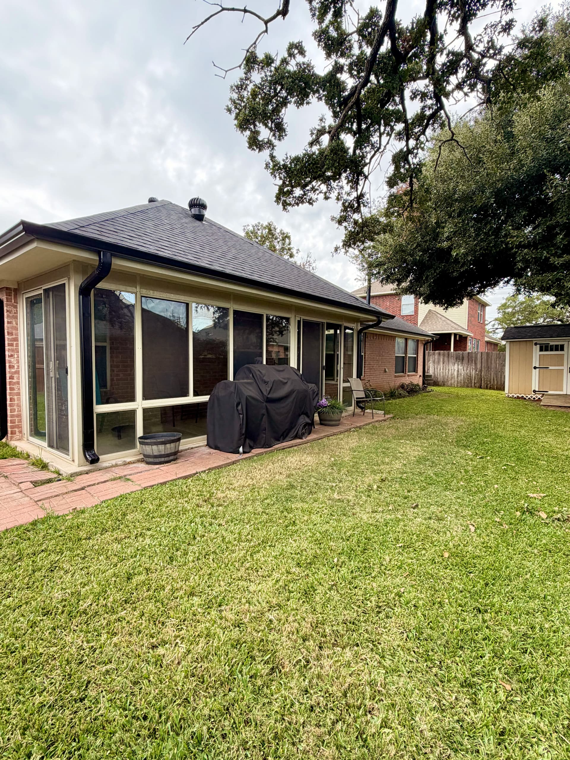 Gallery photos for Black Seamless Gutter Installation After Hail Damage in Burleson: Image #1
