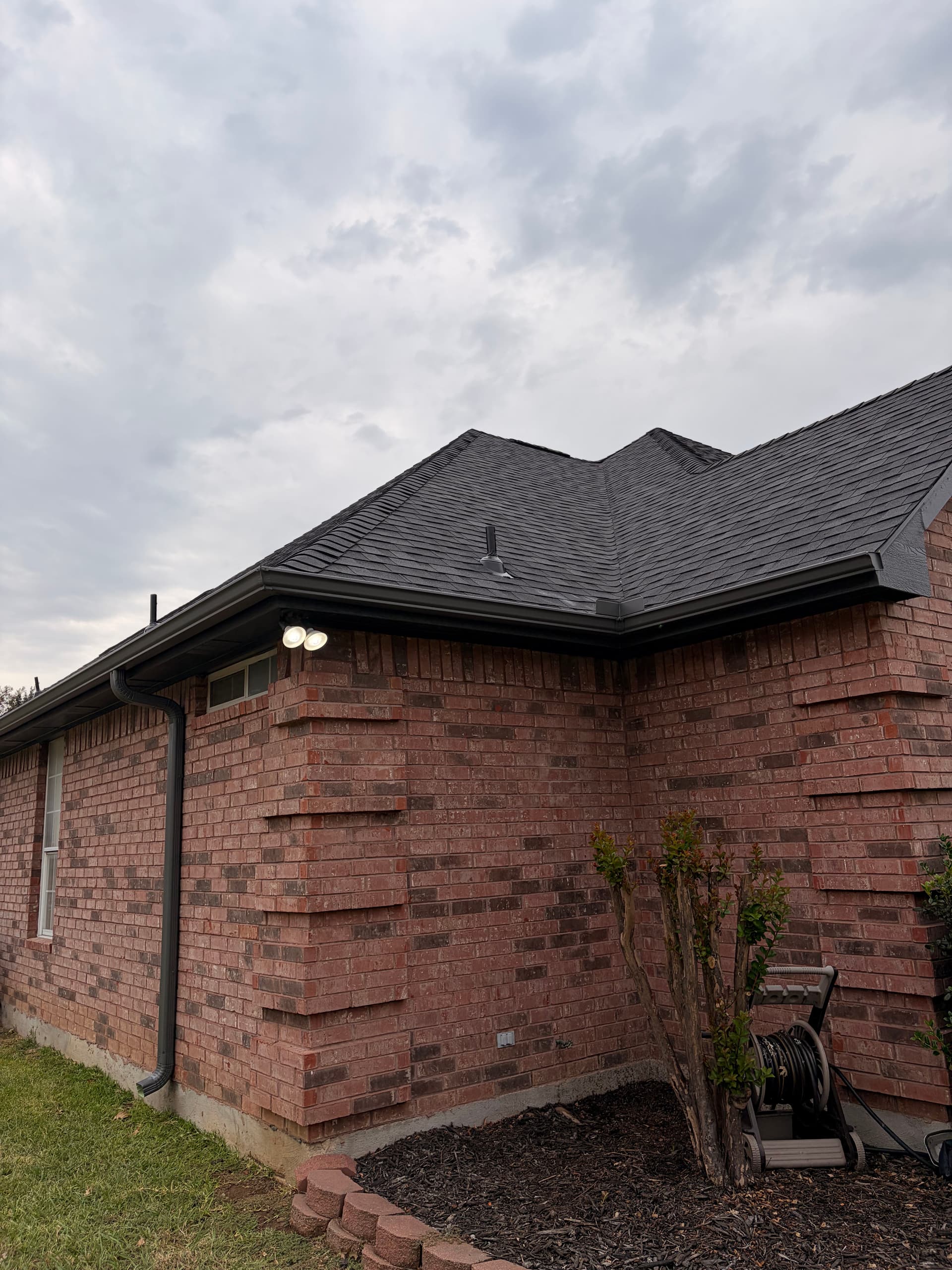 Gallery photos for Tuxedo Gray 5-Inch Seamless Gutters on a Brick Home: Image #3