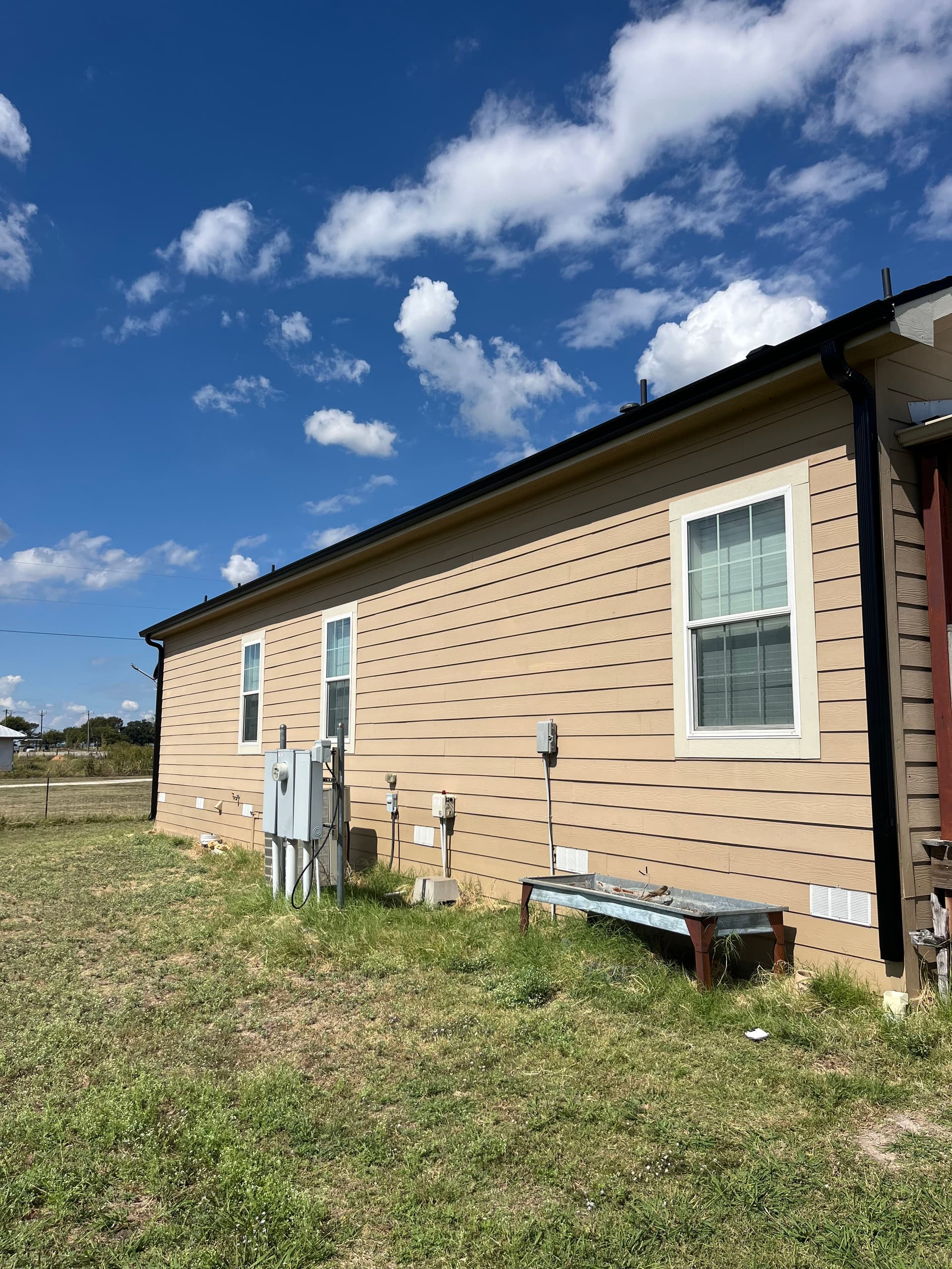 Gallery photos for New Black 5-Inch Gutters Keep This Home Protected: Image #1