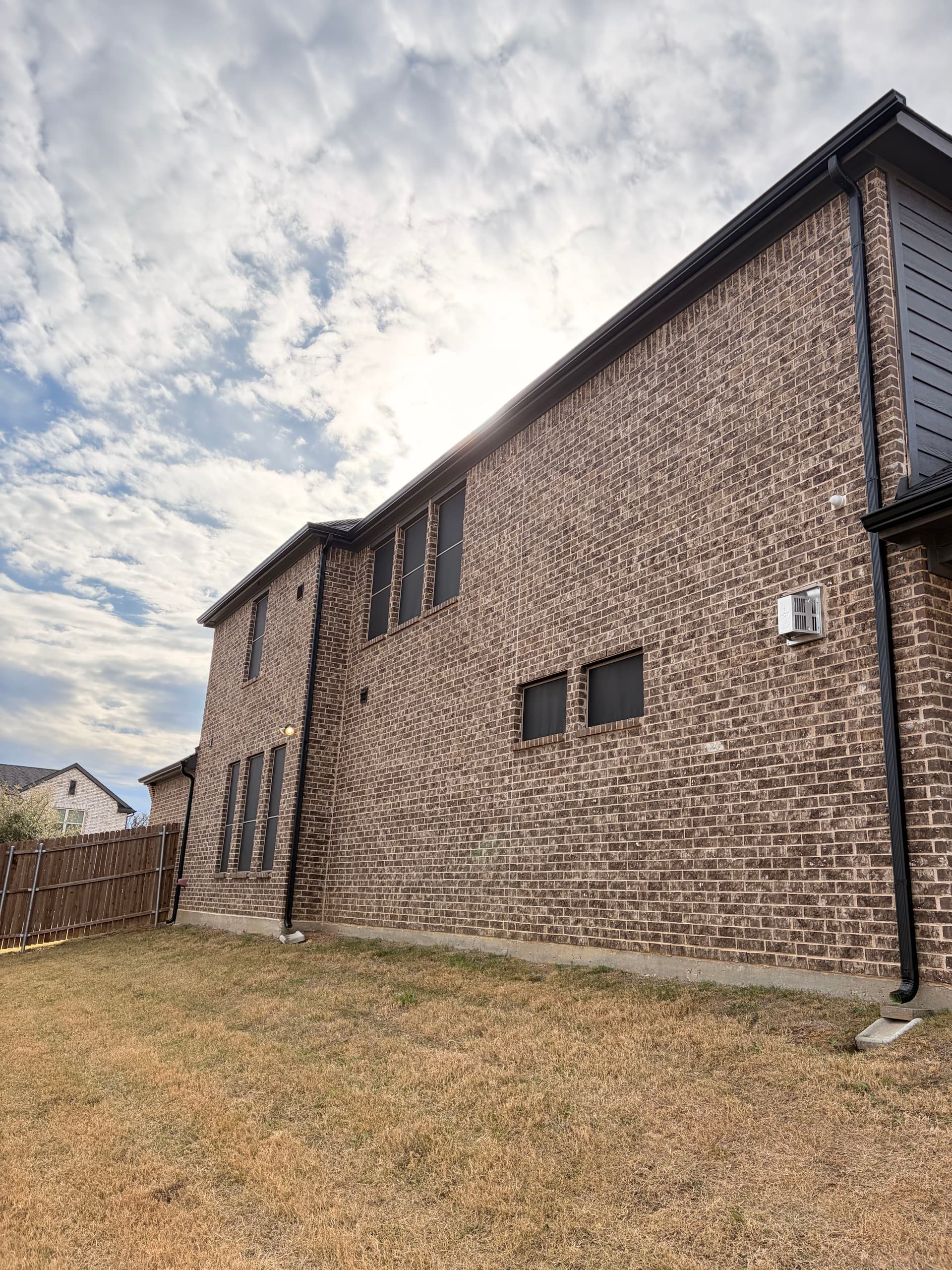 Gallery photos for 2-Story Seamless Black Gutter Install on a Brick Home: Image #2