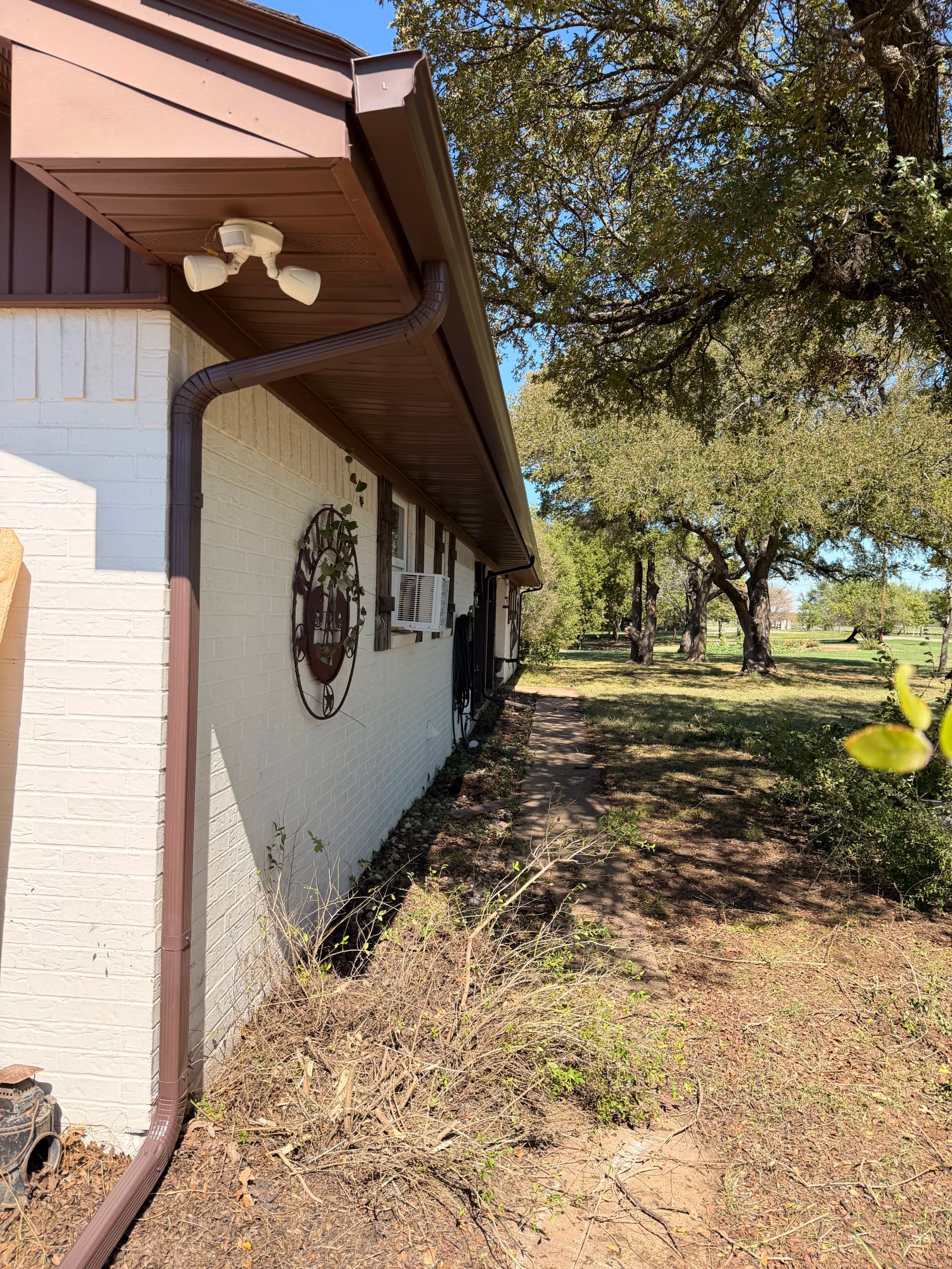 Gallery photos for 83 Feet of Royal Brown Gutter Keeps This Home's Landscaping Protected: Image #2